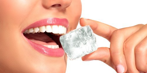picture of a woman enjoys crackin ice cube