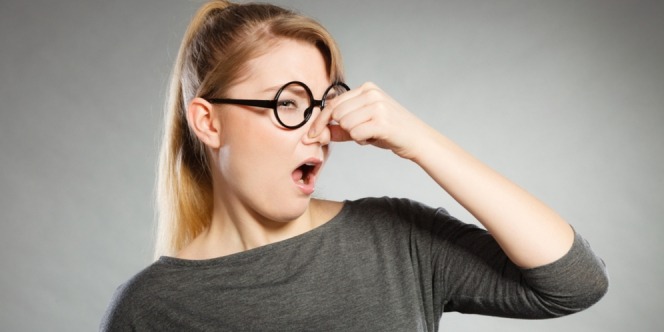 Woman annoyed by bad breath